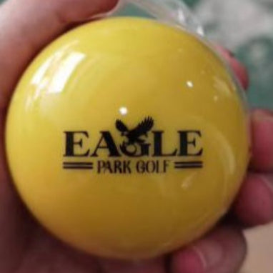 Yellow golf ball with 'Eagle Park Golf' branding.
